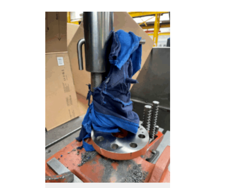 Manufacturing machinery safety audit example showing entanglement risk on a radial-arm drill.